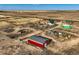 Aerial view of property with home, barn, and horse enclosure at 2255 Calhoun Byers Rd, Byers, CO 80103