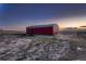 Large red barn with fenced area at 2255 Calhoun Byers Rd, Byers, CO 80103