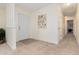 Inviting entryway with light flooring and a hallway at 9812 Lane St, Thornton, CO 80260