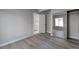 Bright bedroom with mirrored closet doors and wood-look floors at 9995 E Harvard Ave # 179, Denver, CO 80231