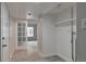 Clean hallway with french doors opening to a living area and storage at 9995 E Harvard Ave # 179, Denver, CO 80231