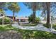 Inviting pool area with a walking path, landscaping, and a tranquil water feature at 9995 E Harvard Ave # 179, Denver, CO 80231