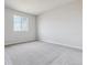 Spacious bedroom with grey carpeting and large window at 4277 Canyata Dr, Elizabeth, CO 80107