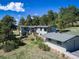 House exterior with attached garage and landscaping at 25853 Mount Vernon Rd, Golden, CO 80401