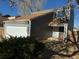 Front view of a two-story house with a garage at 11449 E 1St Ave, Aurora, CO 80010