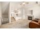 Living room with fireplace, carpeted floors, and loft view at 12022 Locust St, Brighton, CO 80602