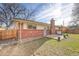 Landscaped backyard with patio and brick home at 1855 S Oswego St, Aurora, CO 80012