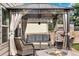 Backyard patio with gazebo, fire pit, and seating area at 1160 Cardinal Ave, Brighton, CO 80601