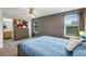 Main bedroom with large bed, dresser and bathroom access at 1160 Cardinal Ave, Brighton, CO 80601