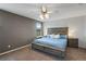 Spacious main bedroom with ceiling fan and en-suite bathroom at 1160 Cardinal Ave, Brighton, CO 80601