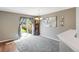 Bright dining room with hardwood floors, a view of the backyard, and a chandelier at 1160 Cardinal Ave, Brighton, CO 80601