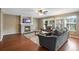 Spacious living room with hardwood floors, a fireplace, and large windows at 1160 Cardinal Ave, Brighton, CO 80601