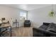 Spacious bedroom with a desk, chair, and couch at 1160 Cardinal Ave, Brighton, CO 80601