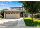 Two-story home with attached garage, well-maintained landscaping, and a welcoming facade at 1160 Cardinal Ave, Brighton, CO 80601