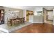 Bright dining room features hardwood floors and access to backyard patio at 1160 Cardinal Ave, Brighton, CO 80601
