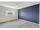 Bright bedroom with neutral walls, carpet, and a window at 1160 Cardinal Ave, Brighton, CO 80601