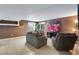 Finished basement recreation area with seating at 1160 Cardinal Ave, Brighton, CO 80601