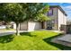 Two-story house with attached garage and landscaped lawn at 1160 Cardinal Ave, Brighton, CO 80601