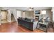 Living room features hardwood floors, fireplace, and ample natural light at 1160 Cardinal Ave, Brighton, CO 80601