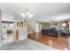 Open concept living room and kitchen with hardwood floors and a fireplace at 1160 Cardinal Ave, Brighton, CO 80601