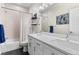 Double vanity bathroom with modern finishes and a shower/tub combo at 1181 S Navajo St, Denver, CO 80223