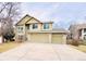 Two-story house with three-car garage and landscaped yard at 13262 Pennsylvania St, Thornton, CO 80241