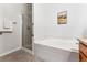 Bathroom with shower and soaking tub at 6061 W Utah Ln, Lakewood, CO 80232