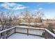 Deck view of a tranquil waterway, walking path, and neighborhood homes at 6061 W Utah Ln, Lakewood, CO 80232