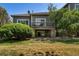 Back of house with deck and landscaping at 6061 W Utah Ln, Lakewood, CO 80232