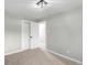 Well-lit bedroom featuring neutral walls and carpet at 2839 W Davies Dr, Littleton, CO 80120