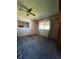 Spacious living room featuring wall-to-wall carpet and a ceiling fan at 650 S Clinton St # 5B, Denver, CO 80247