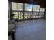 Bright sunroom with tiled floor and view of backyard at 650 S Clinton St # 5B, Denver, CO 80247