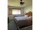 Main bedroom with king-size bed and ceiling fan at 650 S Clinton St # 5B, Denver, CO 80247