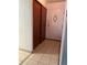 Apartment entryway with double sliding doors and tile floor at 650 S Clinton St # 5B, Denver, CO 80247