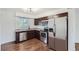 Modern kitchen with stainless steel appliances and granite countertops at 6335 Martin Luther King Jr Blvd, Denver, CO 80207