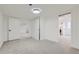 Spacious finished basement bedroom with carpeting and neutral walls at 6335 Martin Luther King Jr Blvd, Denver, CO 80207
