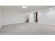 Finished basement room with neutral carpeting and ample space at 6335 Martin Luther King Jr Blvd, Denver, CO 80207