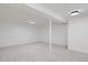 Finished basement room with neutral decor and new lighting at 6335 Martin Luther King Jr Blvd, Denver, CO 80207