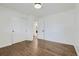 Bright bedroom with hardwood floors and an ensuite bathroom at 6335 Martin Luther King Jr Blvd, Denver, CO 80207