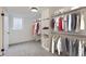 Finished basement closet with ample hanging and shelving space at 6335 Martin Luther King Jr Blvd, Denver, CO 80207