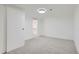 Basement bedroom with grey carpet and lots of closet space at 6335 Martin Luther King Jr Blvd, Denver, CO 80207
