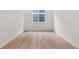 Simple bedroom with hardwood floors and a window at 9314 Quartz St, Arvada, CO 80007