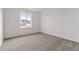 Well-lit bedroom with carpeted floor and window view at 9314 Quartz St, Arvada, CO 80007