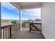 Back deck with views of surrounding houses and landscape at 9314 Quartz St, Arvada, CO 80007