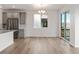 Dining area with hardwood floors and sliding glass doors to deck at 9314 Quartz St, Arvada, CO 80007
