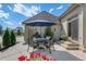 A cozy patio features a table, chairs and umbrella at 7614 Crestview Dr, Niwot, CO 80504