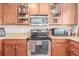 Close-up view of the kitchen's stainless steel appliances and granite countertops at 12921 Grant W Cir # B, Thornton, CO 80241