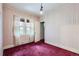 Simple bedroom with carpet, windows, and closet at 5038 W 29Th Ave, Denver, CO 80212