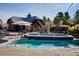 Luxury pool and hot tub area with clubhouse in background at 8830 Witez Ct, Parker, CO 80134