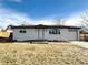 Newly renovated Ranch home with modern exterior and landscaped lawn at 5126 Johnson St, Arvada, CO 80002